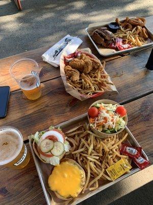 Sandwich (cheeseburger) w/two sides (fries, side salad), kids chicken tender meal and signature (brisket) w/two sides (fries, onion rings).