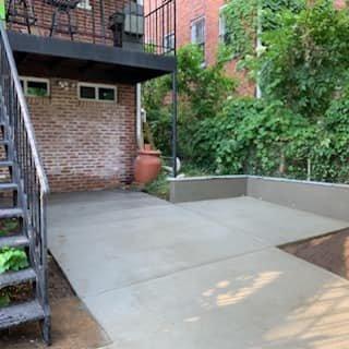 Concrete driveway with a patio section