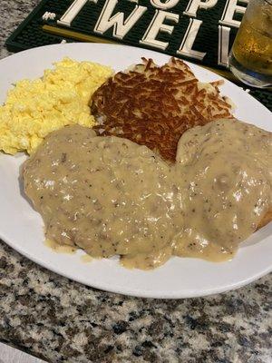 Country fried steak, biscuit &gravy and hash browns and scrambled eggs