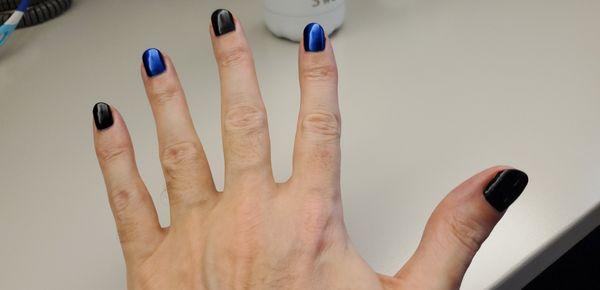 guy hand, black and blue shiny nails.