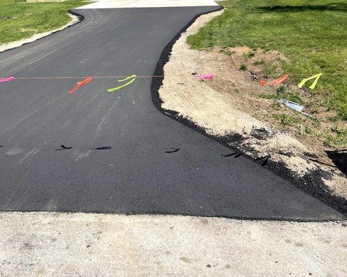 Shows how they didn't take the asphalt all all the way to the grass.  It looks terrible.