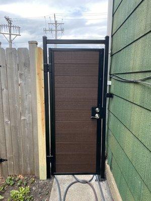 Custom pedestrian gate with European green wood .