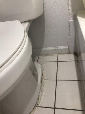 Dirty floor and mobile toilet.