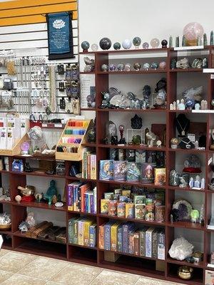 Assorted towers, spheres, tarot and Oracle cards, candles, statues, incense, jewelry