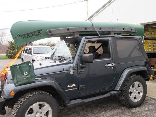 Happy Customer purchasing his brand new 14' Sportspal Canoe from Molnar Outdoor.