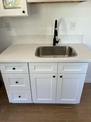 Tiny house kitchen cabinets and faucet