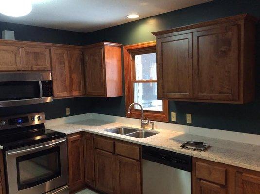 We re-faced that kitchen with a cherry solid wood and upgraded them to soft close hinges and drawers...even added a nice pantry