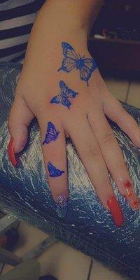 Look at this cute butterfly tattoo! All blue ink!