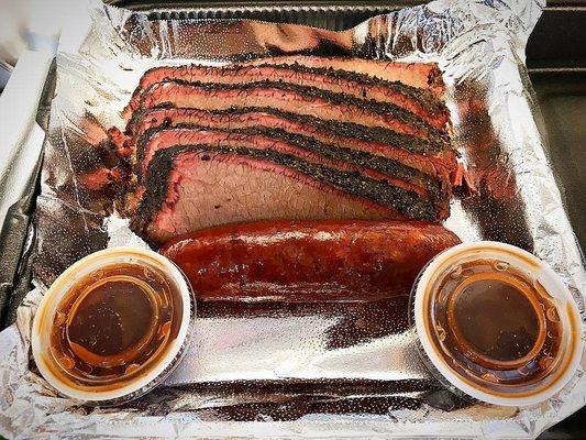 Juicy sliced Texas brisket and a link of Jalapeno Sausage from Victorian's Barbecue