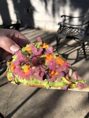 Incredible avocado toast with hot sauce and pickled onions