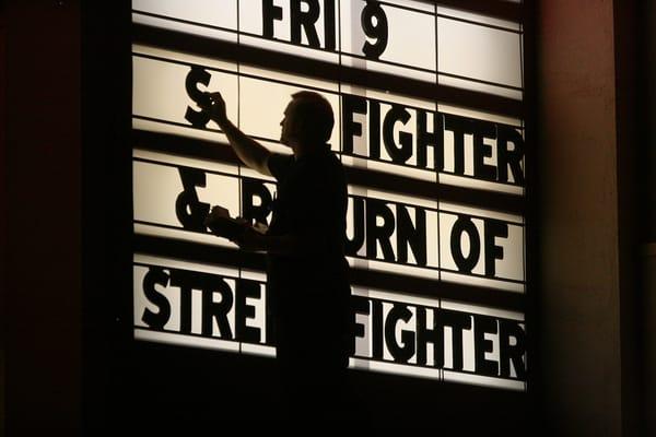 The owner, Brian Cox, doing his nightly routine of changing the famous marquee. All of the letters used are 1938 originals!