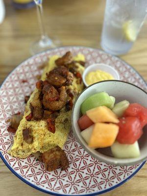 Cajun Shrimp omelet, hollandaise on the side with melon fruit bowl