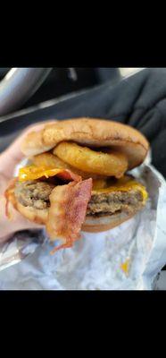 $7 and a 10 minute wait for a cold patty with soggy onion rings, and a flat/squished bun.