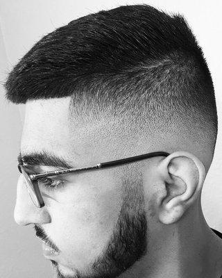 Low razor fade with combover and razor line up on the beard