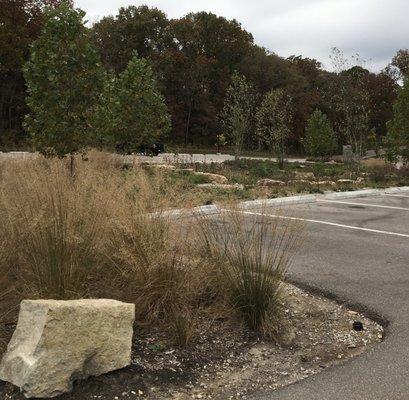 Parking lots are cut into natural settings.