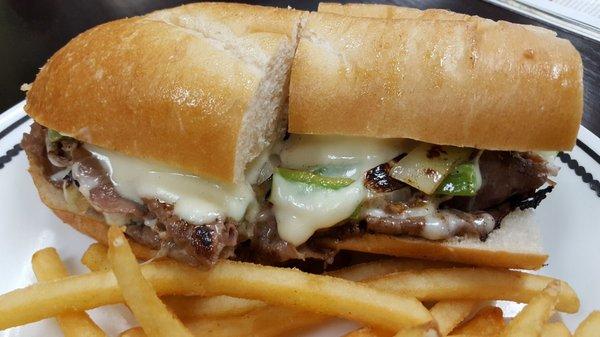 An awesome Philly cheese steak sandwich with equally excellent french fries!