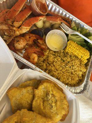 Seafood platter with side of plantains.