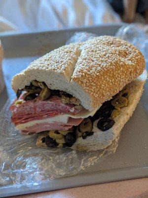 Muffaletta, quarter size.