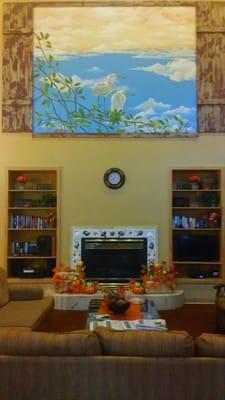 Gorgeous painting and fireplace in the family room