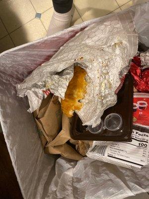 A trash can with Wendy's chicken