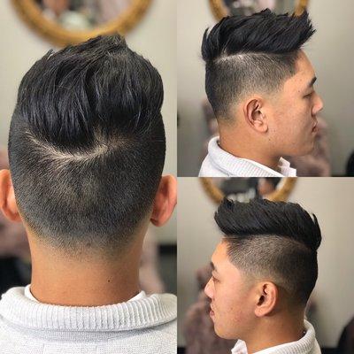 Low taper fade with and a razor cut on top