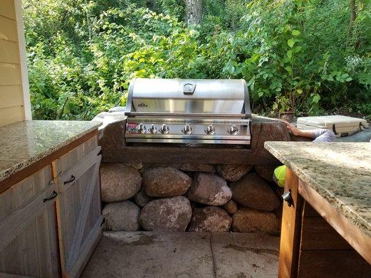 Carved boulders for grill