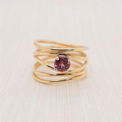 Check out brahimsjewelry.com for this  garnet wire ring!