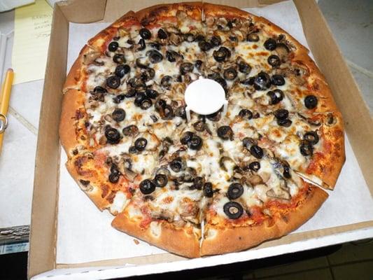 Medium olive and mushroom pizza. Perfect meal for Sunday football games :)