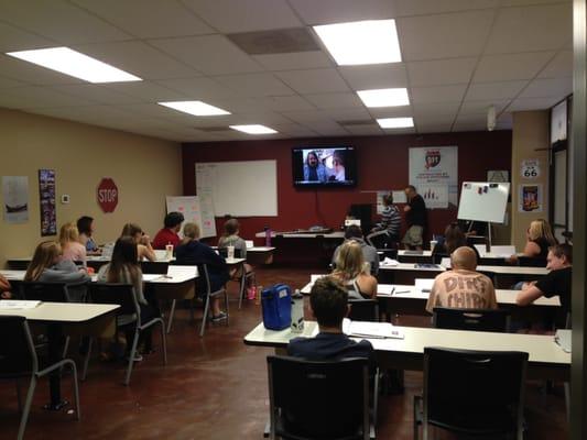 Teens learning in the classroom from our police officer instructor