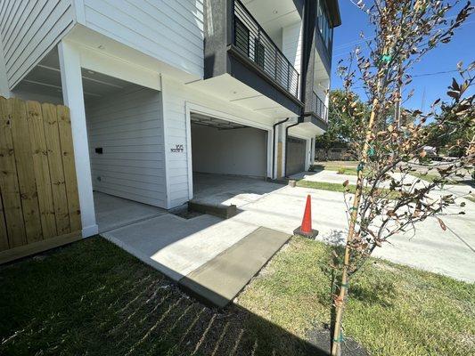 Extended walkway and poured concrete at the base of the new walls