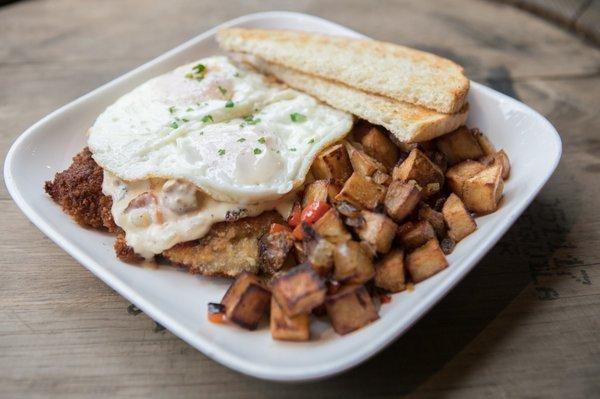 Brunch item. Chicken schnitzel with egg on top