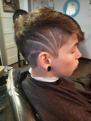 A lovely side shave design on a euro hawk haircut