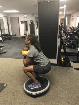 Bosu squats with kettlebells