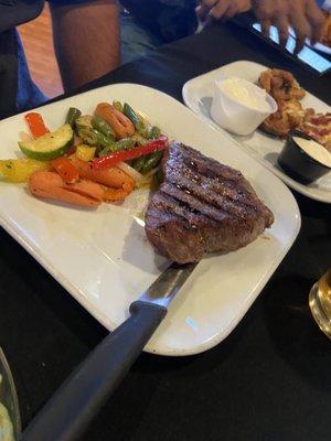 The worst 12 oz steak in the world. This is how it's served. This is what comes with it.