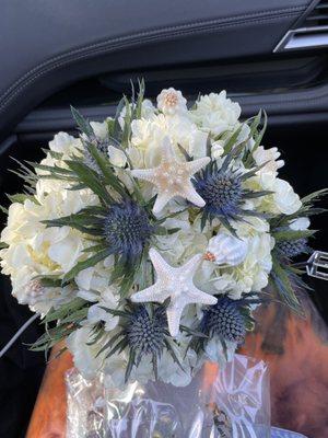 White Hydrangeas and Scottish Thistle with seashell and starfish's inside