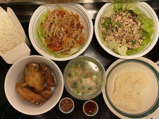 Papaya salad order at max hot, Laab Khai, Khao Piak (chick rice soup), Jurn Gai (wings) with rice and sticky rice. Sept 25, 2021.