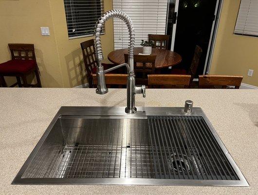 New kitchen sink on Corian countertop