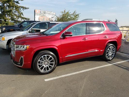 2023 Acadia Denali in Volcanic Red with Light Shale leather interior