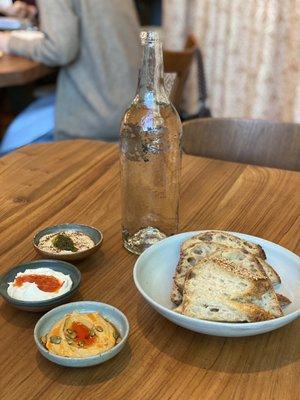 Levain with three spreads (split pea hummus, cultured cashew spread, pumpkin seed dip)