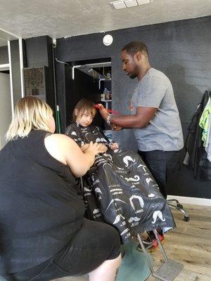 Sherman giving first haircut