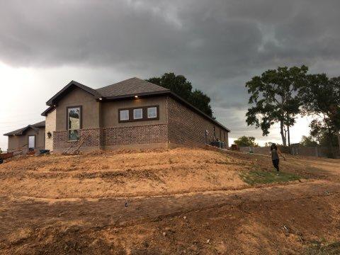 Before 2 story retaining wall.