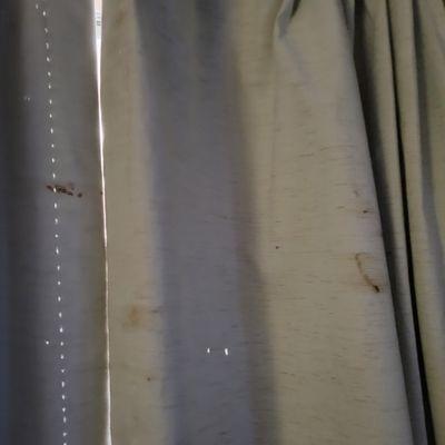 Blood splatters on curtains