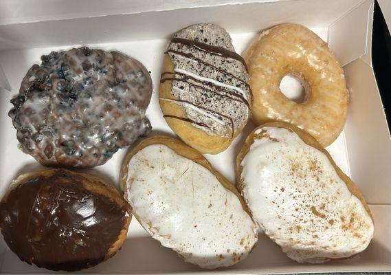 From top left to bottom right- Blueberry Fritter, Oreo Creme, Glazed, Boston Creme, 2 Harvest Apple