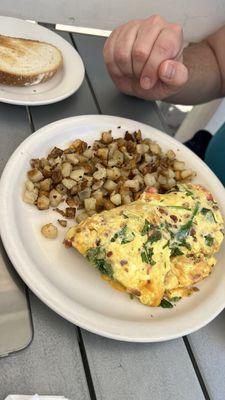 BYO omelet with bacon, tomato, cheddar and spinach with a side of HOUSE HASH