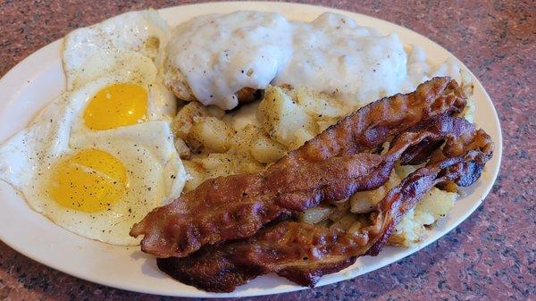 Country Breakfast. 2 eggs, 2 biscuits and gravy, choice of bacon or sausage, and homefries or grits.