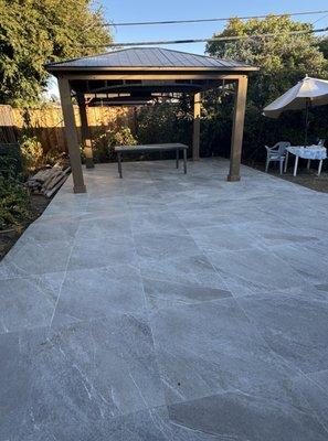 Backyard renovation: An existing patio was extended and tiled, and a gazebo was added.