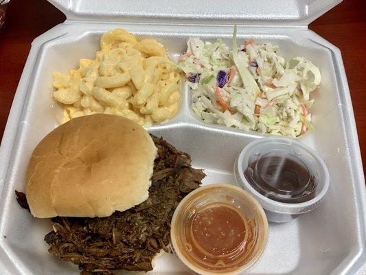 Beef brisket sandwich with Mac and cheese and Cole slaw