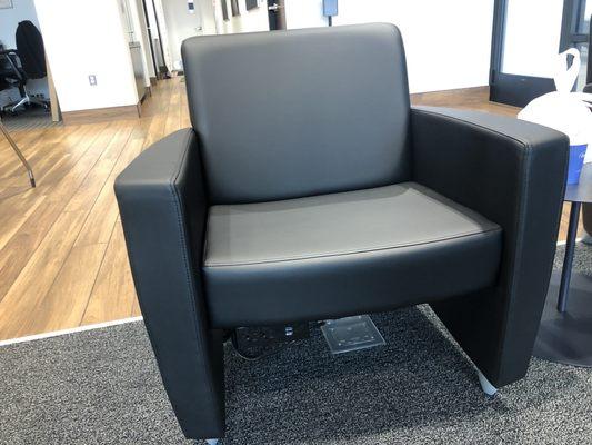 Charging station under chairs in the waiting room.