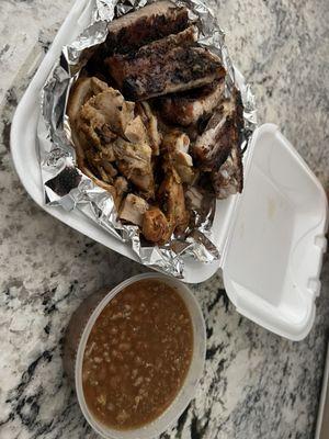 Rib and chicken combo and side of baked beans.