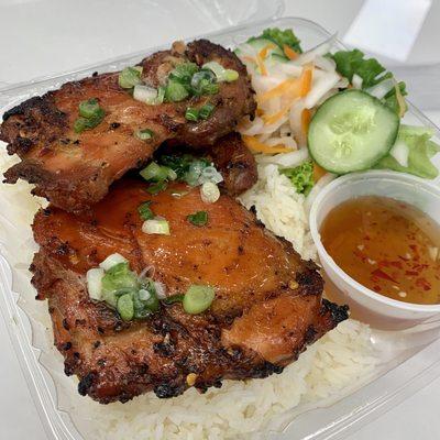 Grilled chicken thighs on rice